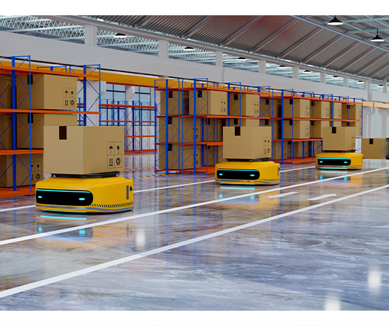 Multiple autonomous mobile robots transporting boxes through a warehouse storage area