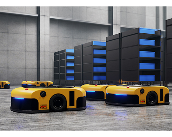 Yellow and black AGVs in a modern warehouse aisle