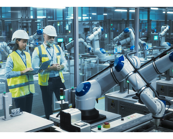 factory-employees-using-laptop-having-conversation